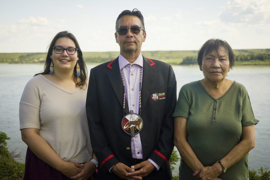 Council members in front of a beautiful lake